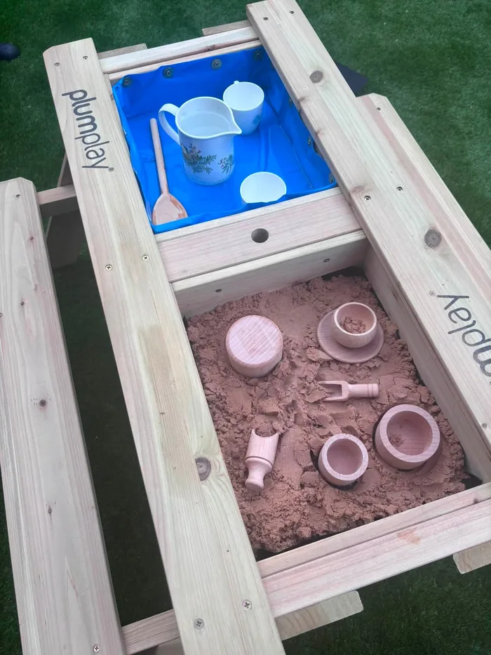 A sandpit set up for outdoor play in the garden